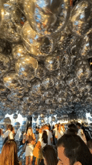 Visitors explore mirrored infinity room at NYC observation deck