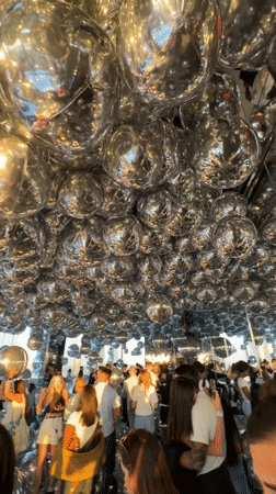 Visitors explore mirrored infinity room at NYC observation deck