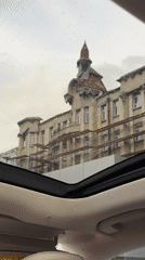 Moscow buildings filmed from luxury car during afternoon drive