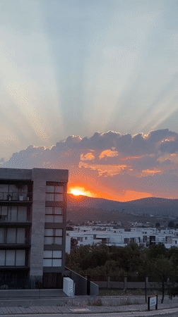 Sunset observed over Santa Clara Ocoyucan cityscape, Mexico