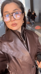 Woman films selfie video outdoors in Khimki, Russia