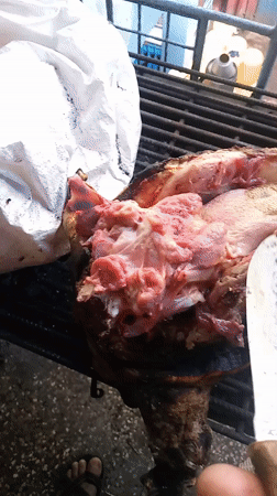 Early morning meat preparation on grill in Nairobi