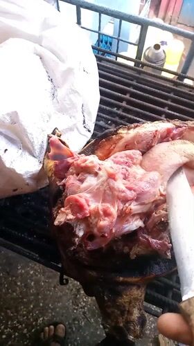 Early morning meat preparation on grill in Nairobi