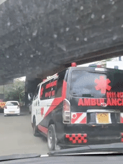 Ambulance travels under bridge in Nairobi