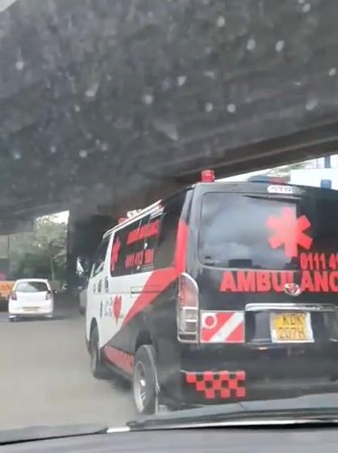 Ambulance travels under bridge in Nairobi