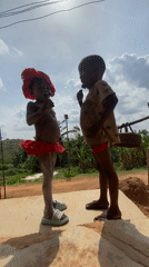 Children celebrate with traditional dress and body paint in Achara
