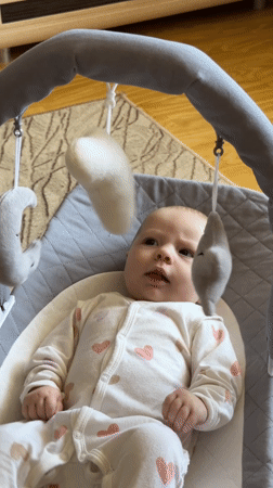 Mother documents morning routine with baby and cat in Chaikovsky