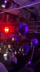 Purple-lit party draws crowds in London venue