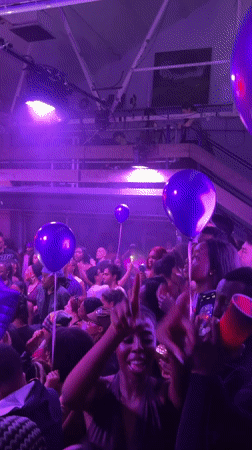 Purple-lit party draws crowds in London venue