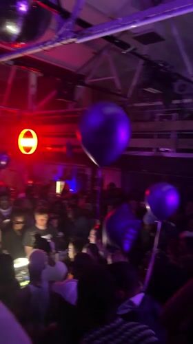 Purple-lit party draws crowds in London venue