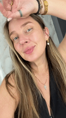 Woman recorded in Moscow bathroom wearing cross necklace
