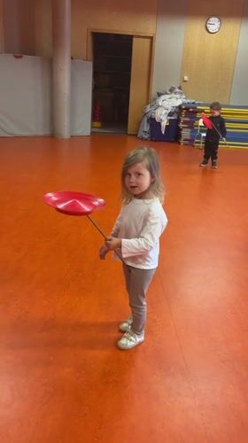 Children practice plate-spinning skills at French gymnasium