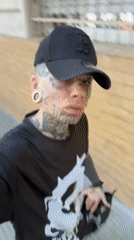 Tattooed person spotted walking in Buenos Aires carrying cloth