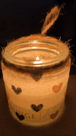 Candlelit jars and aurora projections in a moody Krefeld interior