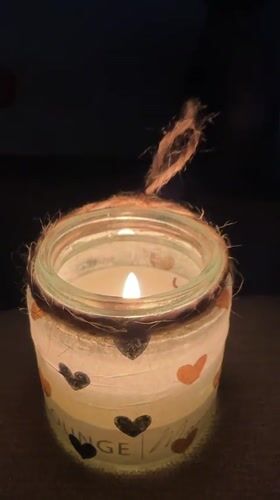 Candlelit jars and aurora projections in a moody Krefeld interior