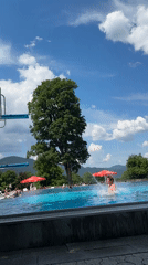 Backflip off the diving board at an Oberammergau outdoor pool
