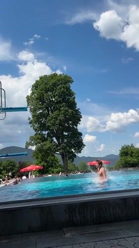 Backflip off the diving board at an Oberammergau outdoor pool