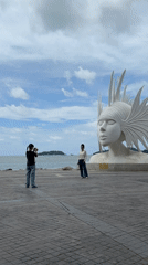 Waterfront sculpture in Phuket draws playful crowd interaction
