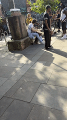 Street performers draw crowds near Manchester mural
