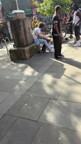 Street performers draw crowds near Manchester mural