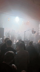 Moscow nightclub scene captured in red-lit crowded venue