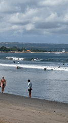 Morning surfing activity observed at Kuta Beach, Indonesia