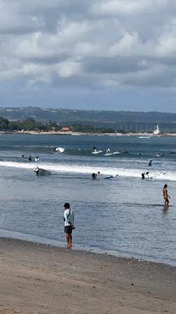 Morning surfing activity observed at Kuta Beach, Indonesia