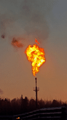 Industrial tower flame erupts at Russian facility during sunset