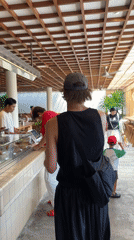 Morning cafe customer queues for pastries in North Kuta