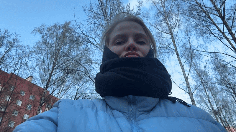 Woman films selfies in Saint Petersburg park playground