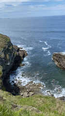 Coastal waves filmed from cliff vantage point in Gijón
