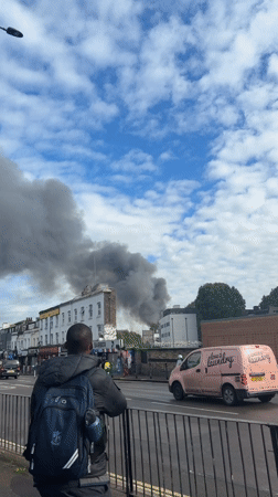 Dark smoke billows above London buildings Monday afternoon
