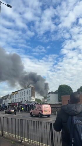 Dark smoke billows above London buildings Monday afternoon