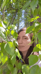 Woman poses with urban greenery in morning photo sequence