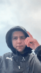 Person glides downhill on foot during rainy weather in Zlatograd