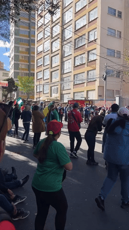 Street gathering with flags observed in La Paz, Bolivia