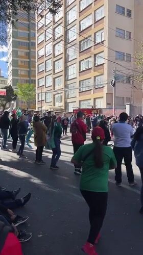 Street gathering with flags observed in La Paz, Bolivia