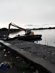 Dredging operations continue at dusk in Lhokseumawe waterway