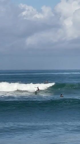 Early morning surfing session captured off Kediri coast
