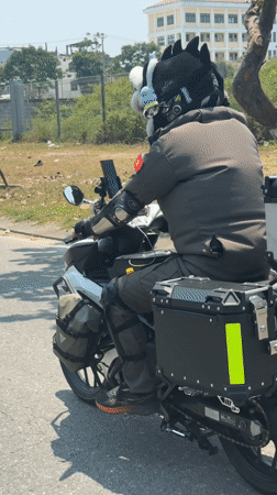 Motorcyclist with spiked helmet rides through Da Nang streets