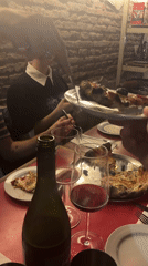 Late-night diners gather at Buenos Aires pizzeria for wine, food