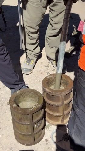 Workers conduct concrete testing procedures in Putre, Chile