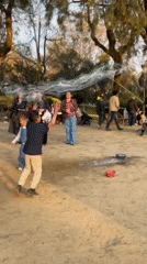 Weekend crowds dance and play at Barcelona's Ciutadella Park