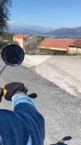 Motorcycle rider travels through rural Montenegro villages