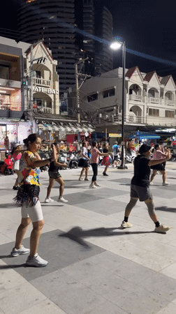 Nighttime group fitness class draws dozens to Pattaya square