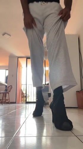 Young man tries on Pikachu hat, poses in Porlamar apartment