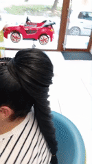 Elaborate braiding session with colorful extensions in Shumen