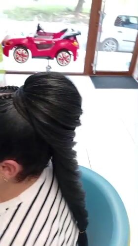 Elaborate braiding session with colorful extensions in Shumen