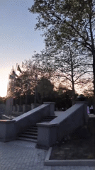 Mykolaiv's Victory Garden fountain lit up at dusk