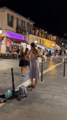 Violin music on a cobblestone European street at night